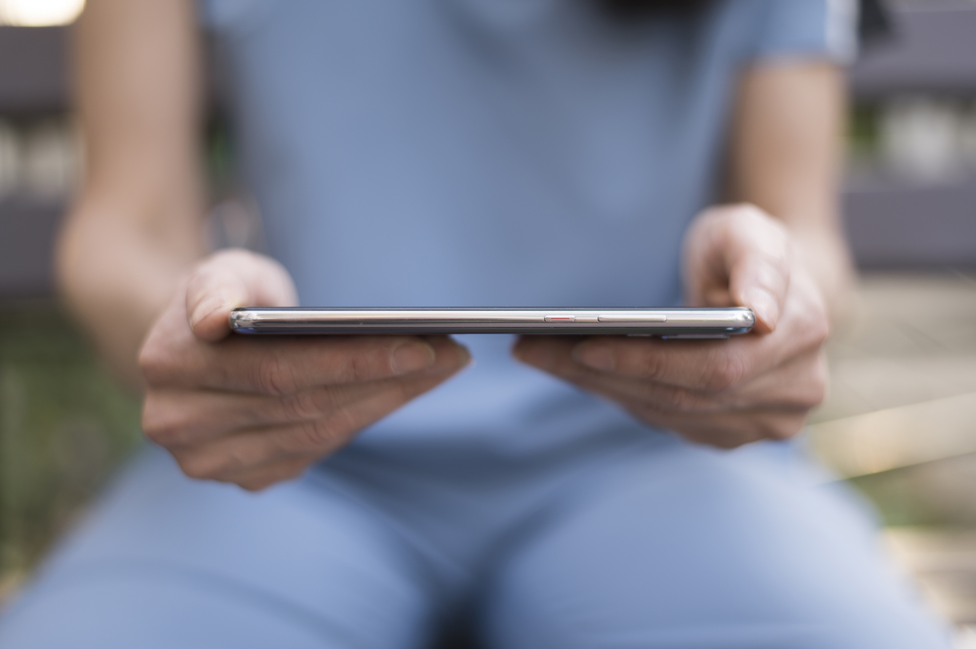 front-view-woman-holding-phone.jpg